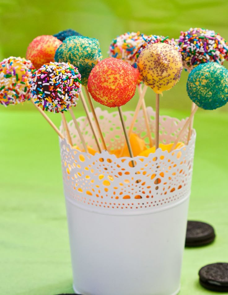 cake pops with sprinkles are in a cup