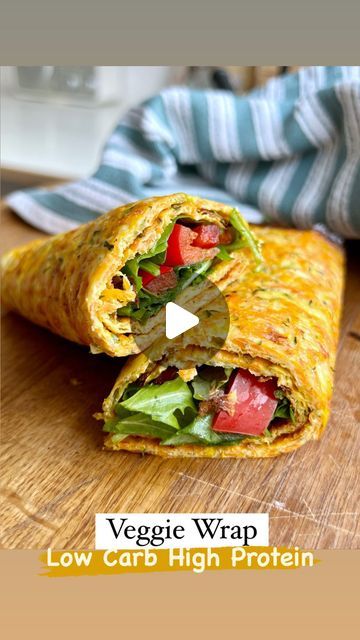 a veggie wrap is cut in half on a cutting board with the words low carb high protein