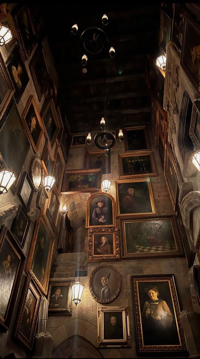 the ceiling is covered with many paintings and lights, along with pictures on the walls