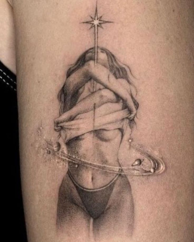 a woman's thigh with a cross on it