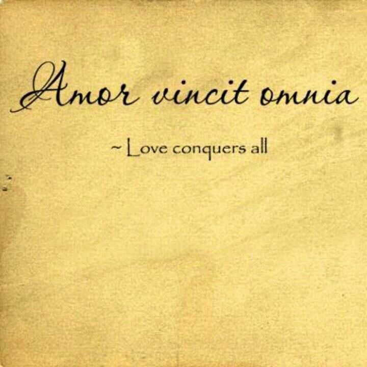 an old piece of paper with the words love conquers all