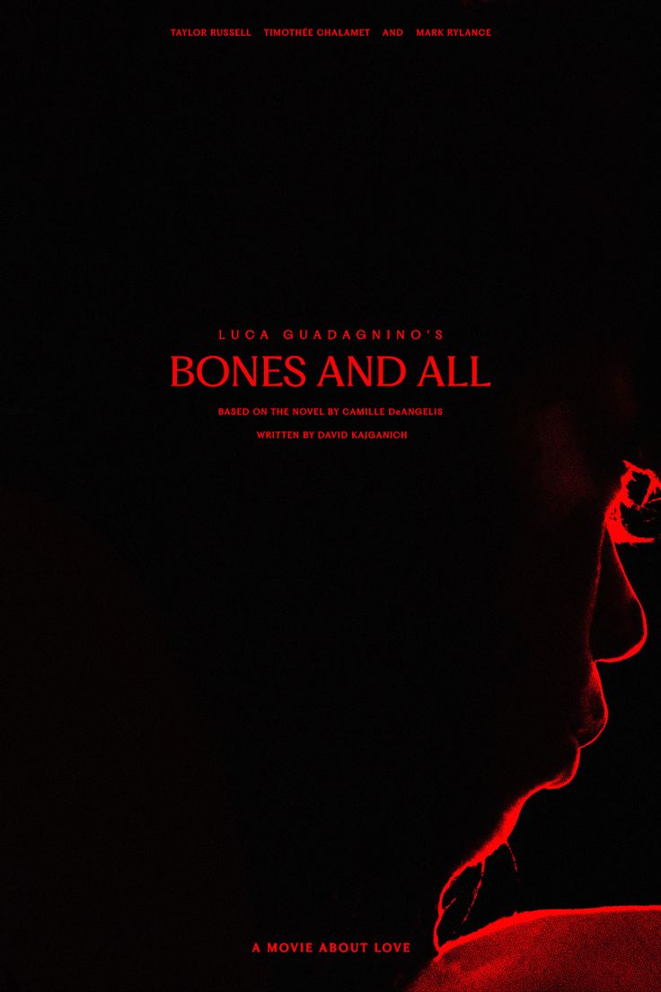 a movie poster for the film bones and all, with a man's face illuminated in red