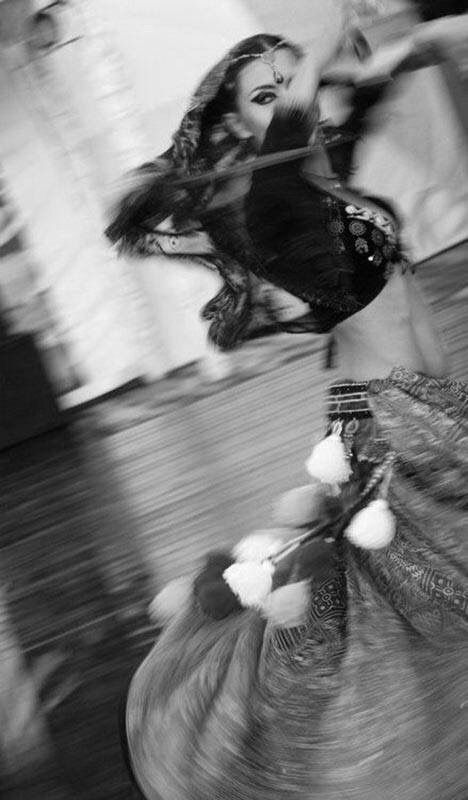 a black and white photo of a woman flying through the air