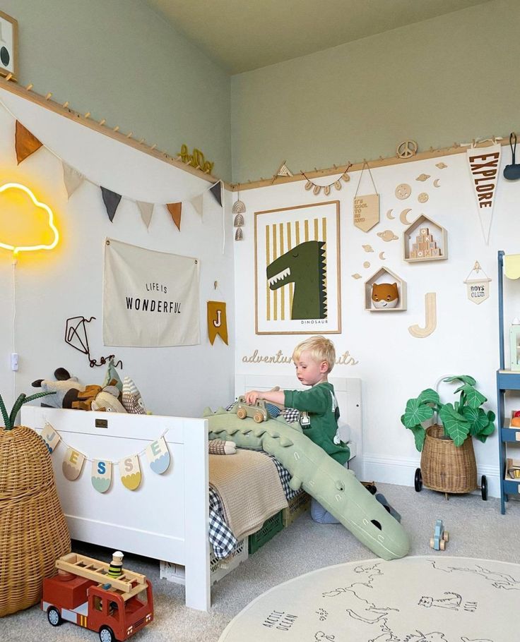 Discover 35 kids room ideas that merge playfulness with practicality. Explore enchanting themes from serene canopies to creative explorer dens. Perfect for parents looking to craft a nurturing space that fosters imagination, comfort, and joy for their children's growth and play. Boys Toddler Room Ideas, Preschool Boy Bedroom Ideas, Toddler Room Themes Boy, Toddler Boy Room Inspiration, Bright Colored Rooms, Baby Boy Toddler Room, Toddler Room Design Boy, Small Kids Room Ideas For Boys, Toddler Room Set Up