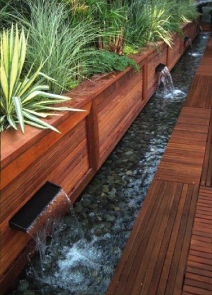 a wooden deck with water running through it