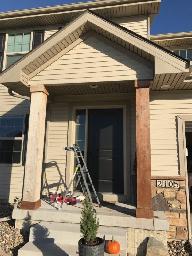 a house that is being painted with some paint on the front porch and steps leading up to it