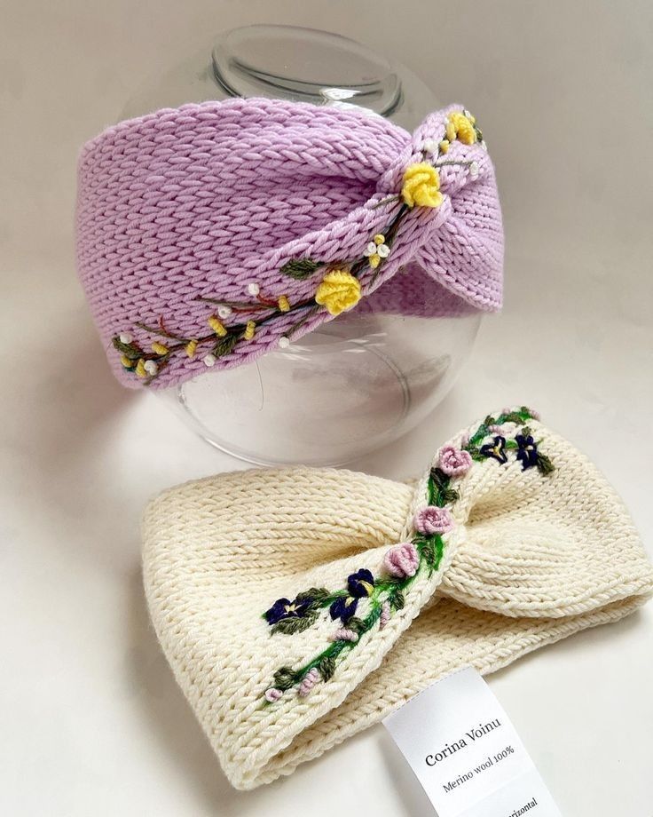 a knitted hat and bow tie sitting on top of a table