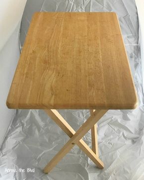 a wooden table sitting on top of aluminum foil