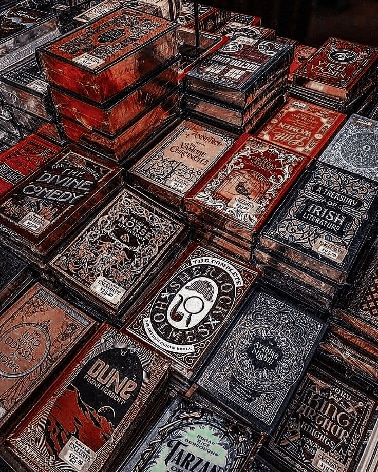 many wooden boxes are stacked on top of each other in this artistic photo, with the lids open