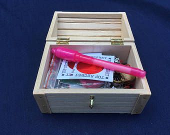 a wooden box filled with lots of different items