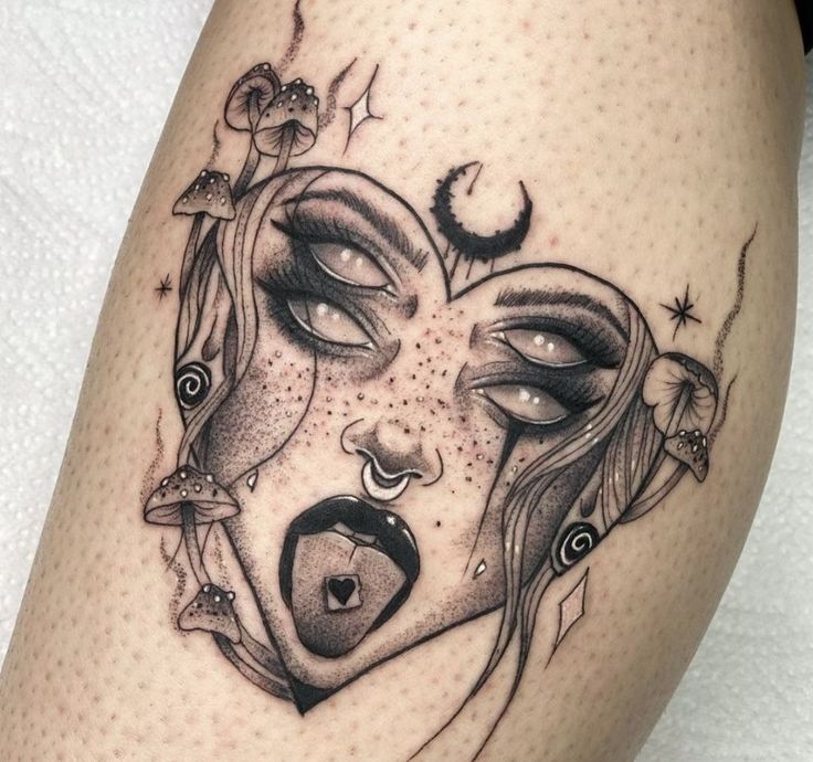 a woman's face with an open mouth and stars on her head is depicted in this tattoo design