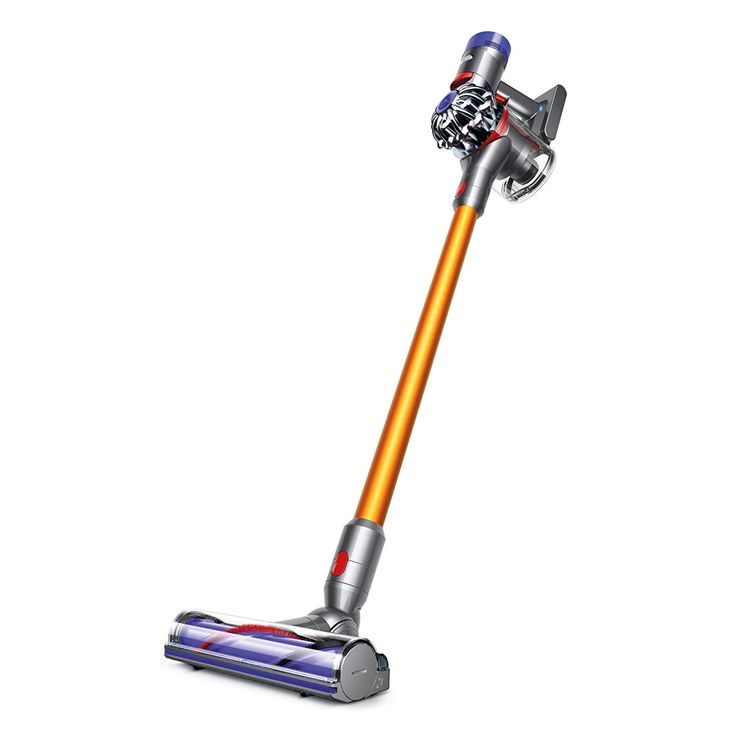 a person using a cordless vacuum to clean the floor