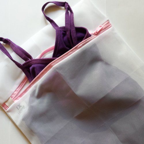 the inside of a purple and white bag