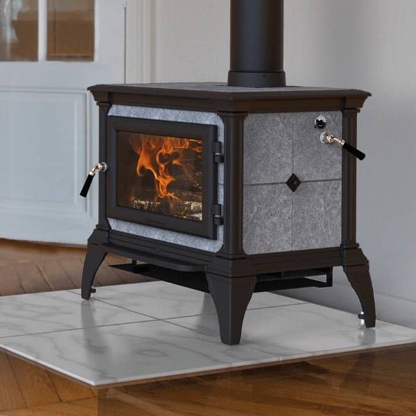 a stove that is sitting in the middle of a room