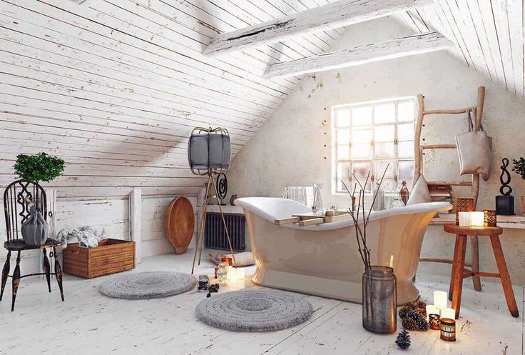 an attic bathroom with white walls and wood flooring, including a claw foot bathtub