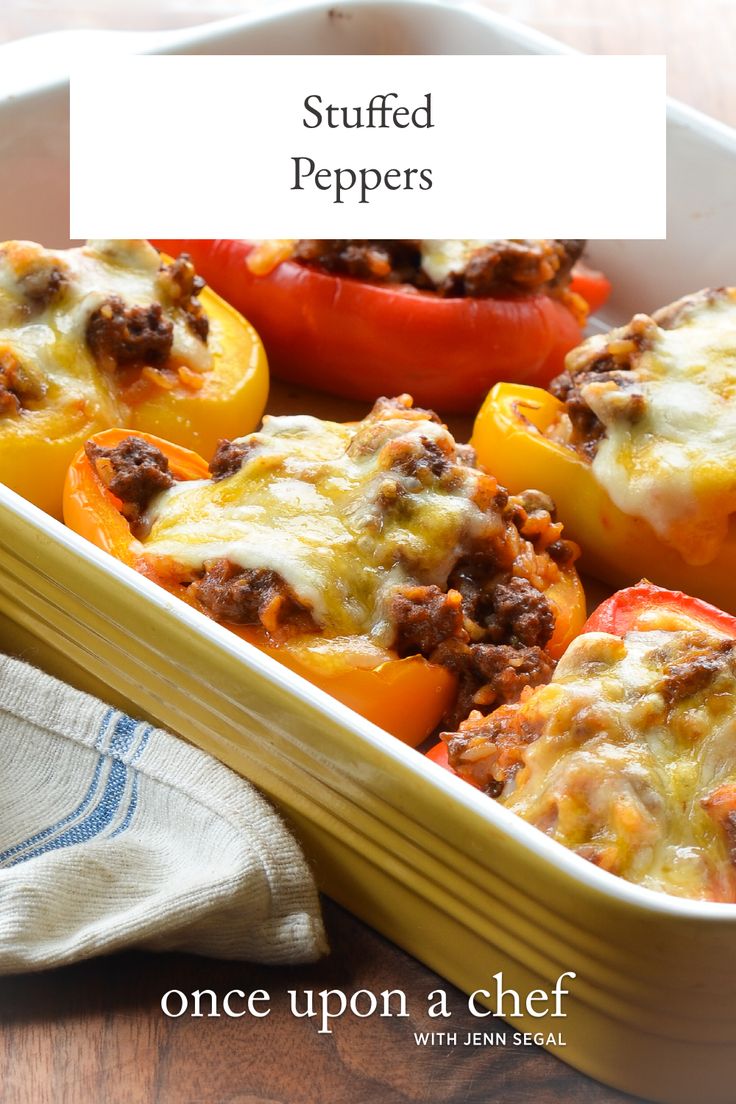 stuffed peppers in a casserole dish on a wooden table with the title above it