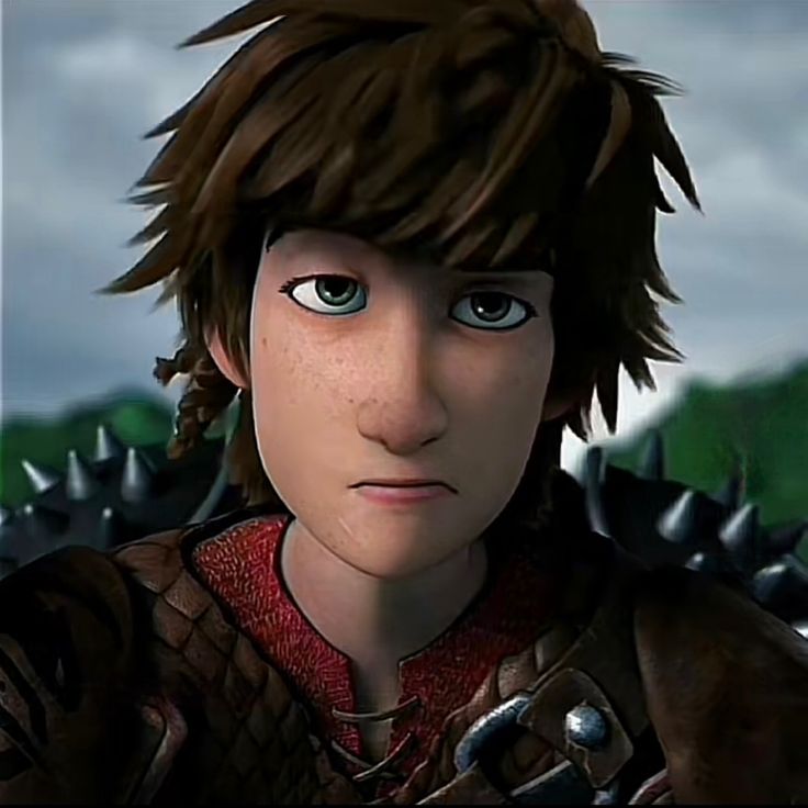 an animated image of a boy with spiked hair and blue eyes looking at the camera