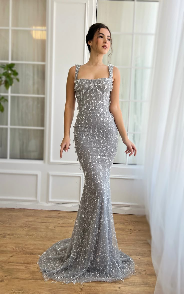 Discover elegance redefined with our exquisite sequined gown, designed to make every moment unforgettable. Crafted from high-shine, silver sequined fabric, this masterpiece is intricately adorned with crystal clear tear-drop embroidery, ensuring you sparkle from every angle. The dress features a flattering sweetheart neckline, complemented by a bodice with built-in pads and boning for a sculpted silhouette. Embrace the allure of the mermaid silhouette, meticulously fitted through the hips and th Elegant Silver Mermaid Dress For Prom Season, Dresses With Crystals, Engagement Dress, Cute Prom Dresses, فستان سهرة, Dream Dresses, Gala Dresses, Silver Dress, Glam Dresses