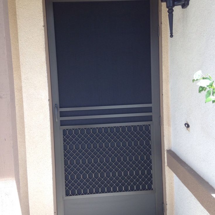 an open door with a black screen on it