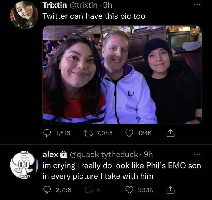 two women and a man are smiling for the camera