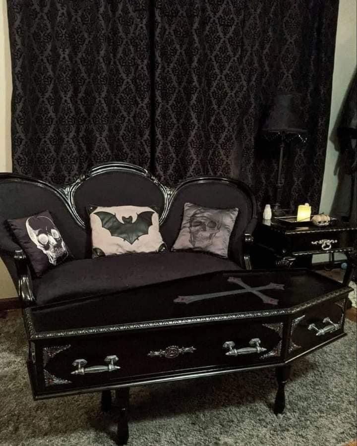 a black couch with some pillows on it