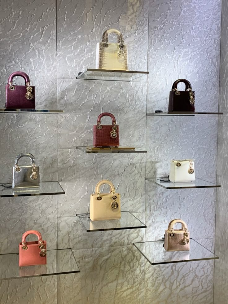 a display case filled with lots of different types of purses