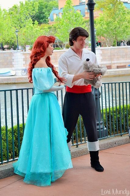 a man and woman dressed up as ariel and prince from the little mermaid are standing next to each other