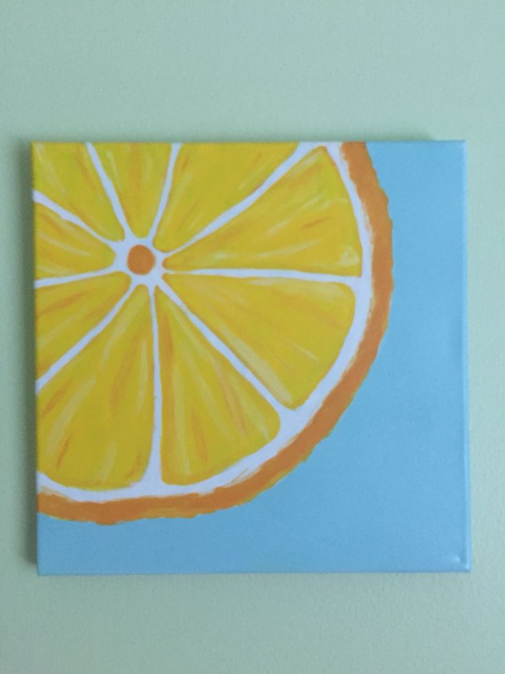 a painting of an orange slice on a blue background