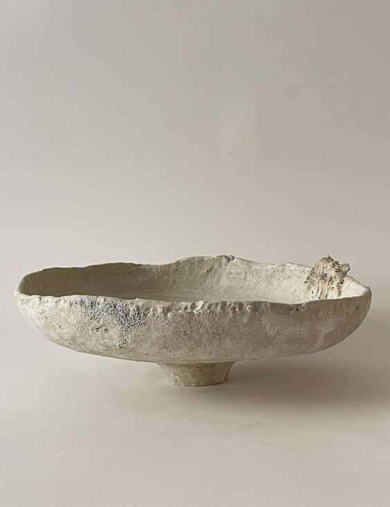 a white bowl sitting on top of a table