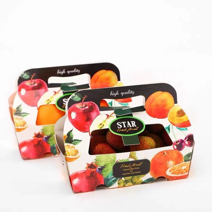 two boxes filled with different types of fruit