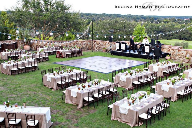 an outdoor venue set up with tables and chairs