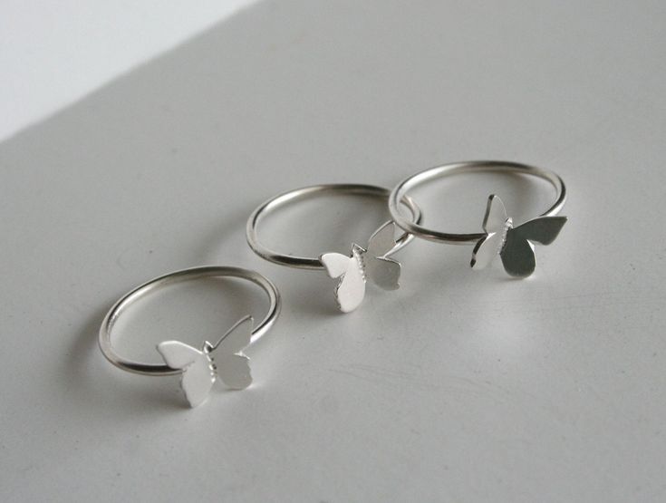 "Beautiful Set of Stacking Butterfly Rings! Each butterfly is drawn, cut and textured by hand, from solid sterling silver, making each one unique.They're individually soldered to they're own handmade sterling silver ring. The rings can be worn all together or separate. The butterfly's are about 3/8\". Rings can also be made in different sizes if you would like them for different fingers. Comes gift wrapped! Each item is handcrafted per order. Please let us know if you need multiple items boxed s Stacking Rings Silver, Rings Butterfly, Butterfly Rings, Rings Stacking, Bff Jewelry, Jewelry Nature, Handmade Sterling Silver Rings, Jewelry Words, Three Rings