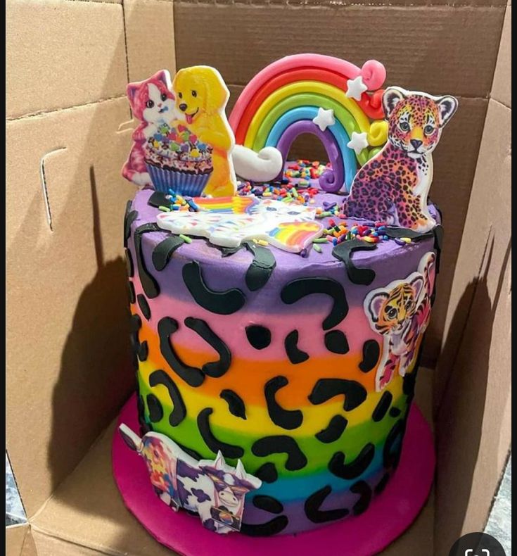 a colorful birthday cake in a cardboard box