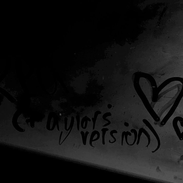 graffiti written on the side of a wall with hearts and words in black and white