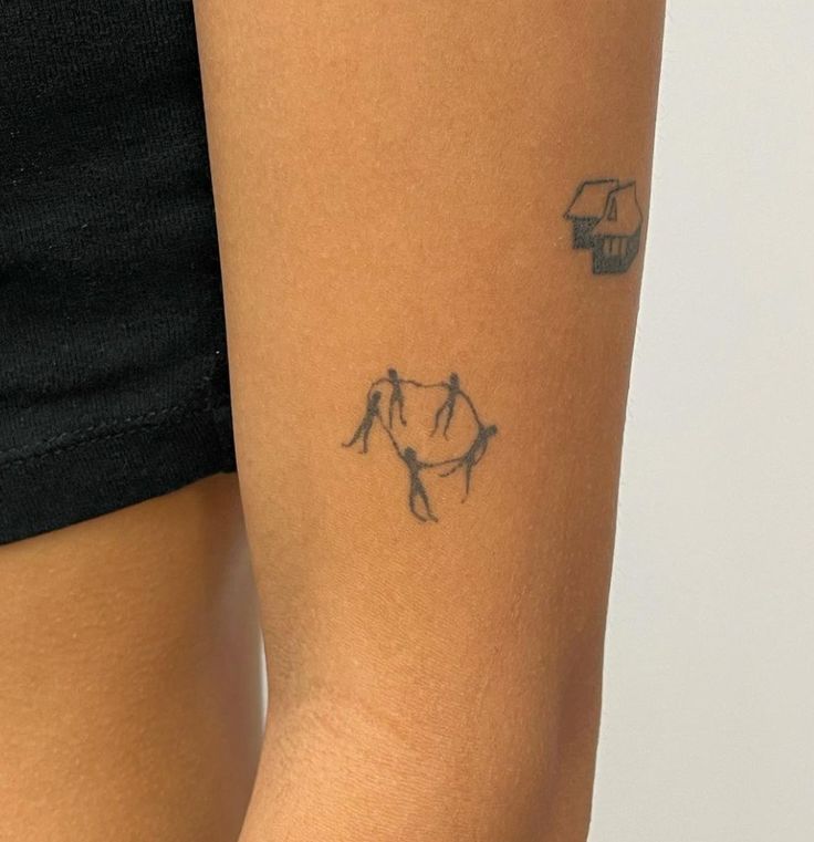 a woman with a tattoo on her arm