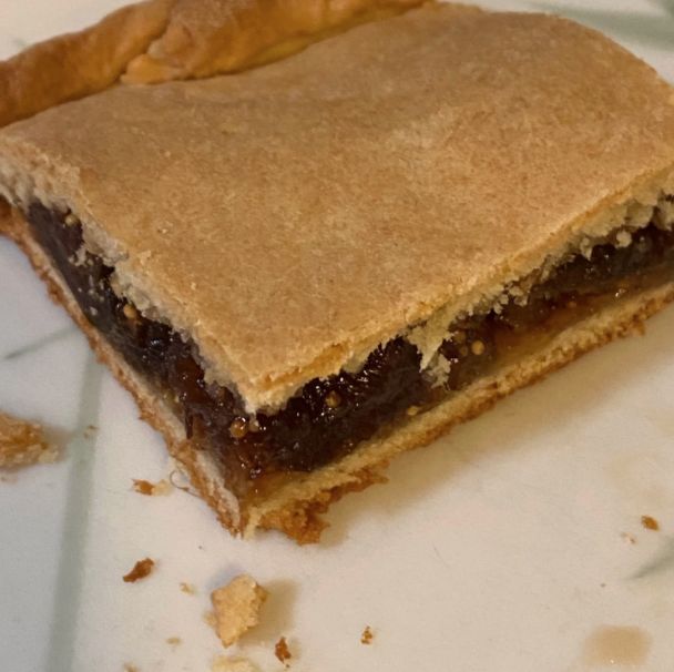 a piece of pie sitting on top of a white plate