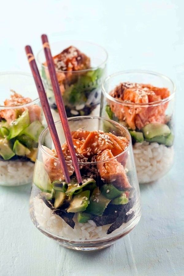 three small bowls filled with food and chopsticks on top of each other,