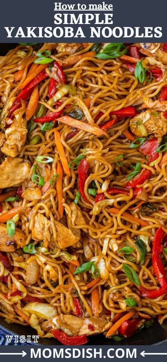 a wok filled with noodles and vegetables