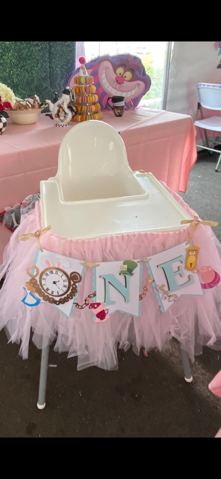 a baby's first birthday party with pink table cloths and decorations on it