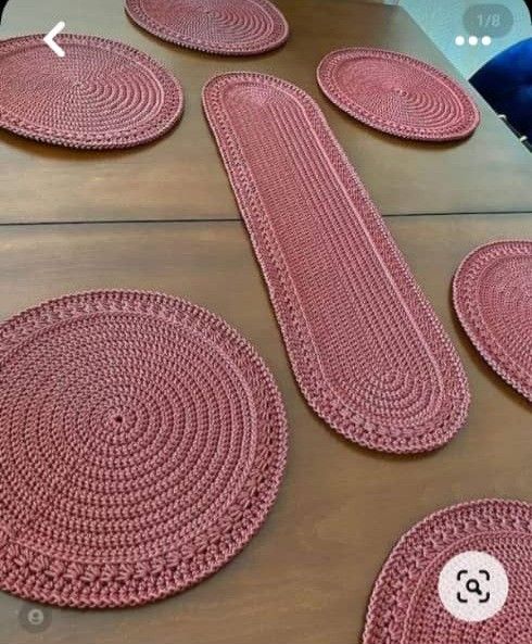 pink placemats and rugs laid out on a table