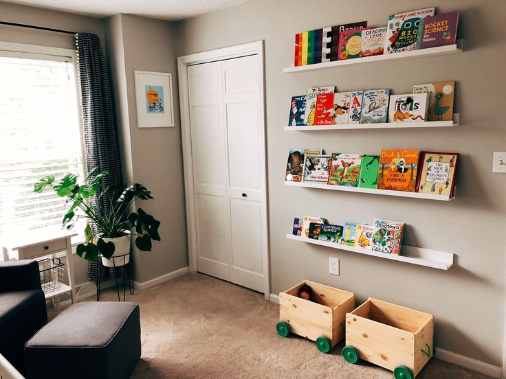 a living room filled with furniture and bookshelves