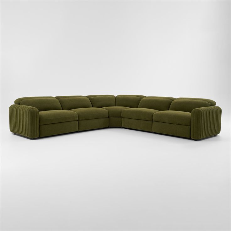 a large green sectional couch with two reclinings on the back and one end