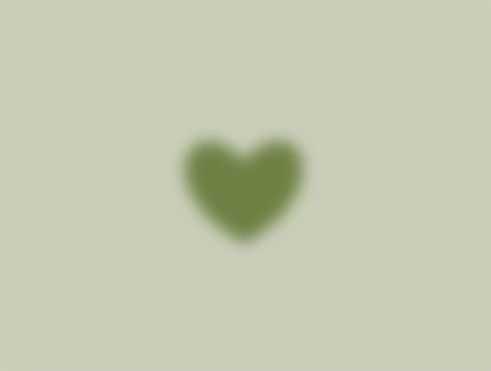 a green heart on a light green background