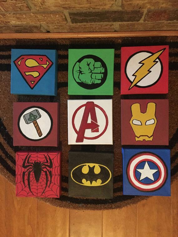 the door mat is decorated with various superhero logos