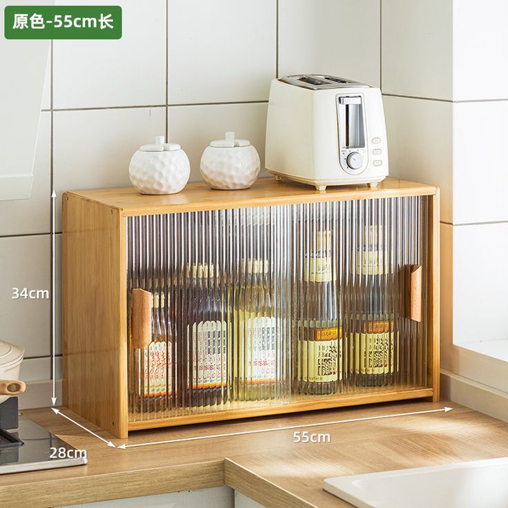 an image of a toaster on top of a cabinet with spices and condiments