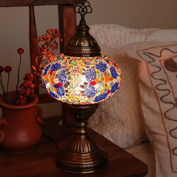 a lamp sitting on top of a wooden table