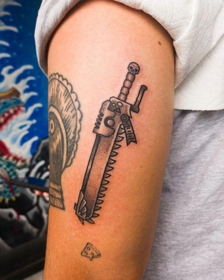 a person with a tattoo on their arm holding a knife