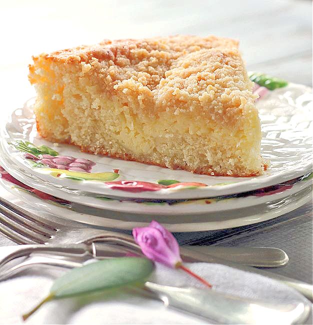 a piece of cake sitting on top of a plate next to a fork and knife