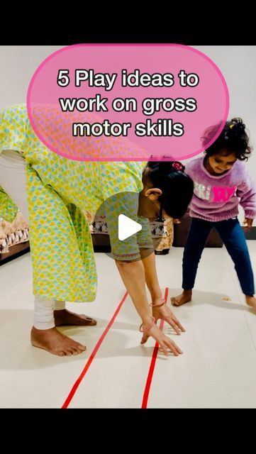 three children are playing on the floor with their hands and legs in front of them