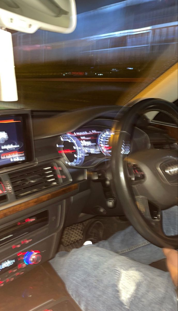 the interior of a car with dashboard lights and electronic devices on it's dash